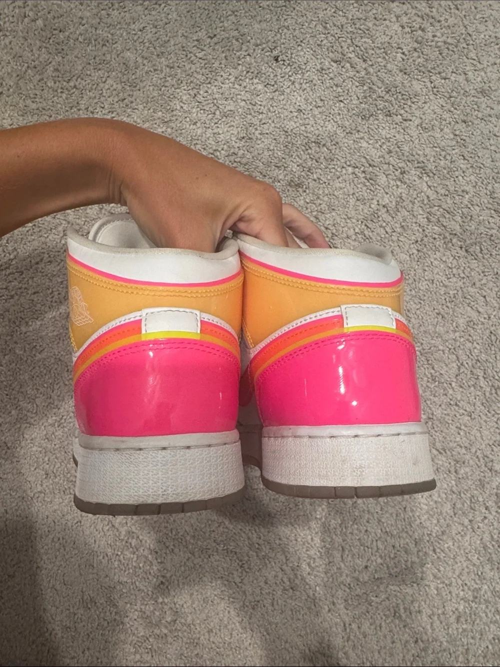 Kids Jordan White High-Top Sneakers with Neon Pink and Orange Accents